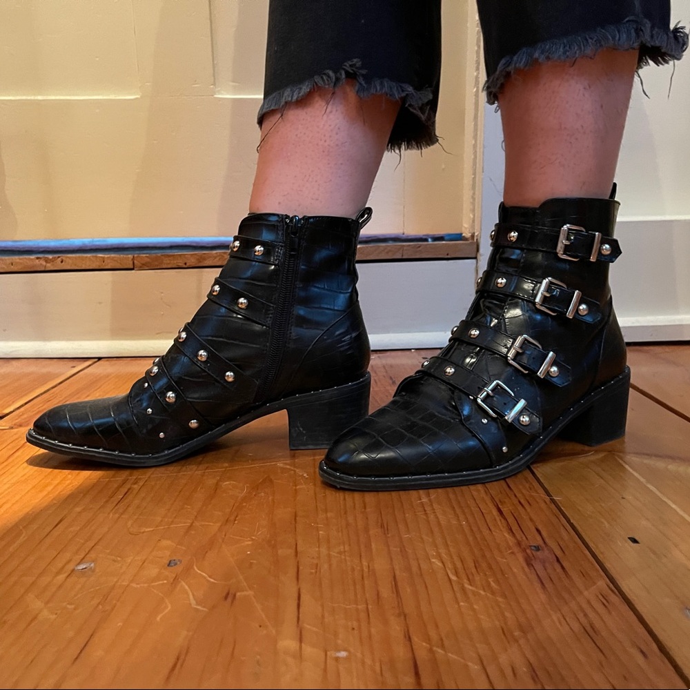 Black studded woman’s shoes worn once